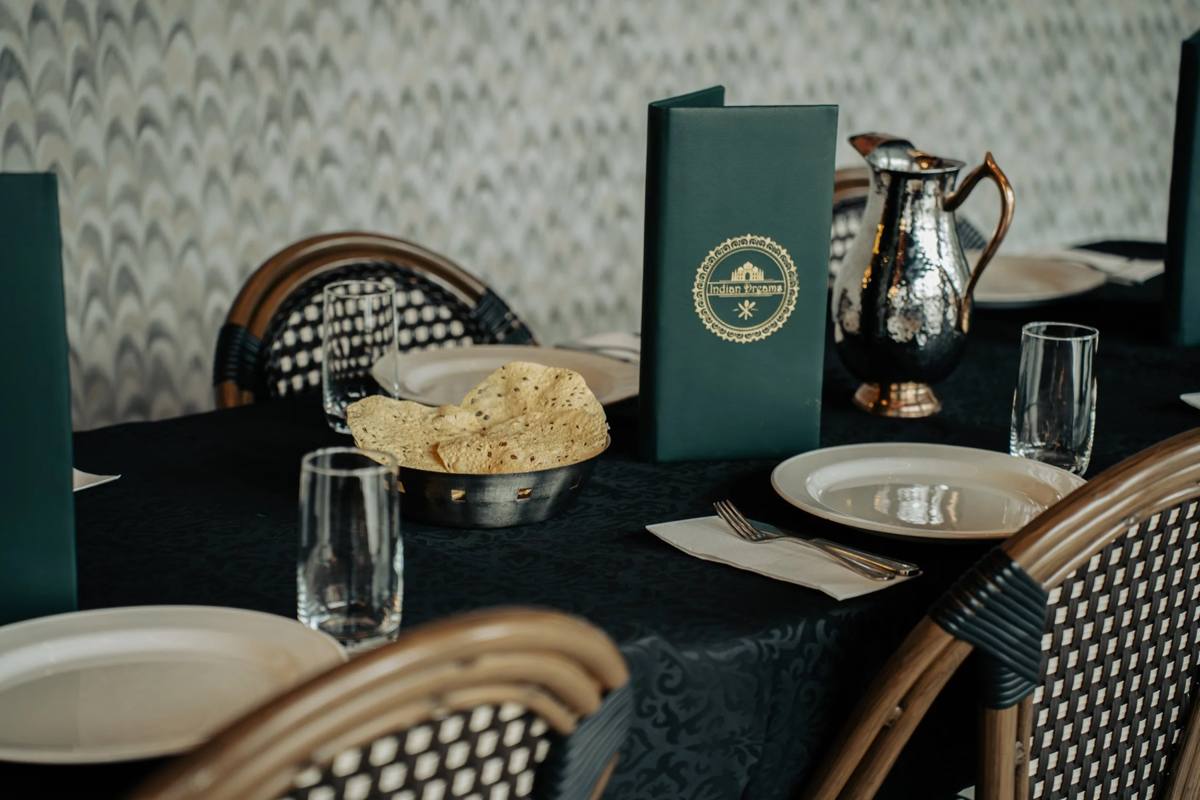 Table setting with menus and poppadoms