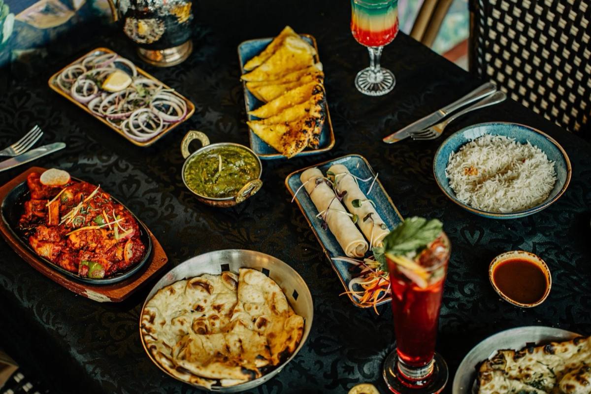 A banquet spread of starters, curries and naan